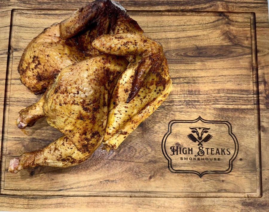 A whole smoked chicken fresh off the smoker
