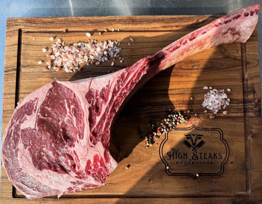Hand-cut tomahawk ribeye seasoned with sea salt at High Steaks Smokehouse in Osage Beach